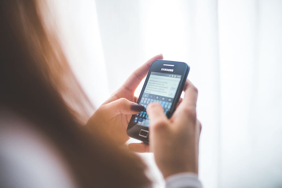 person holding black Samsung Android smartphone, girl, typing HD wallpaper