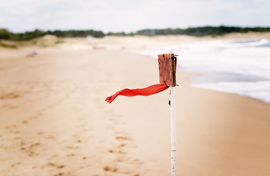 red flag on seashore at daytime, untitled, beach, wind, ribbon, HD wallpaper