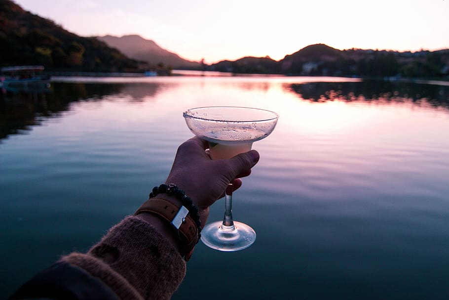 person holding cocktail glass, person holding martini glass, drink, HD wallpaper