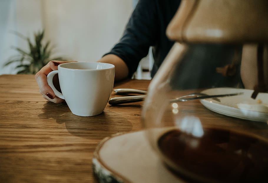 person in front of white ceramic cup, drink, table, desk, jug HD wallpaper