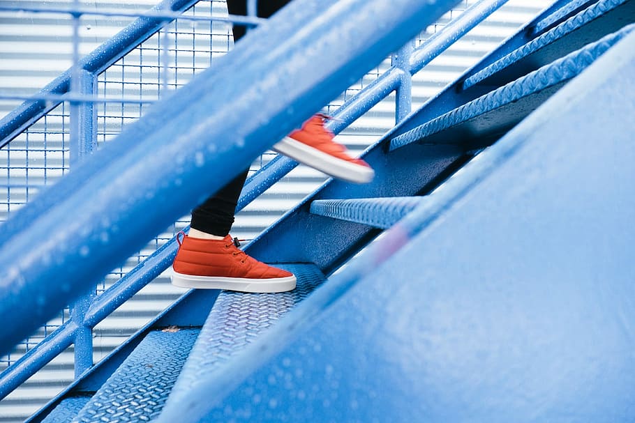 person stepping on blue stairs, person stepping up blue steel stairs HD wallpaper