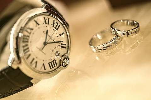 silver-colored analog watch near two silver-colored rings, round silver-colored analog watch with black strap and rings HD wallpaper
