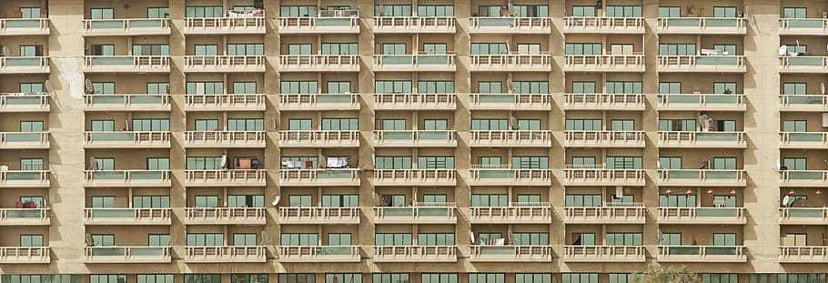gray and green concrete buildings, building in shallow focus photography HD wallpaper