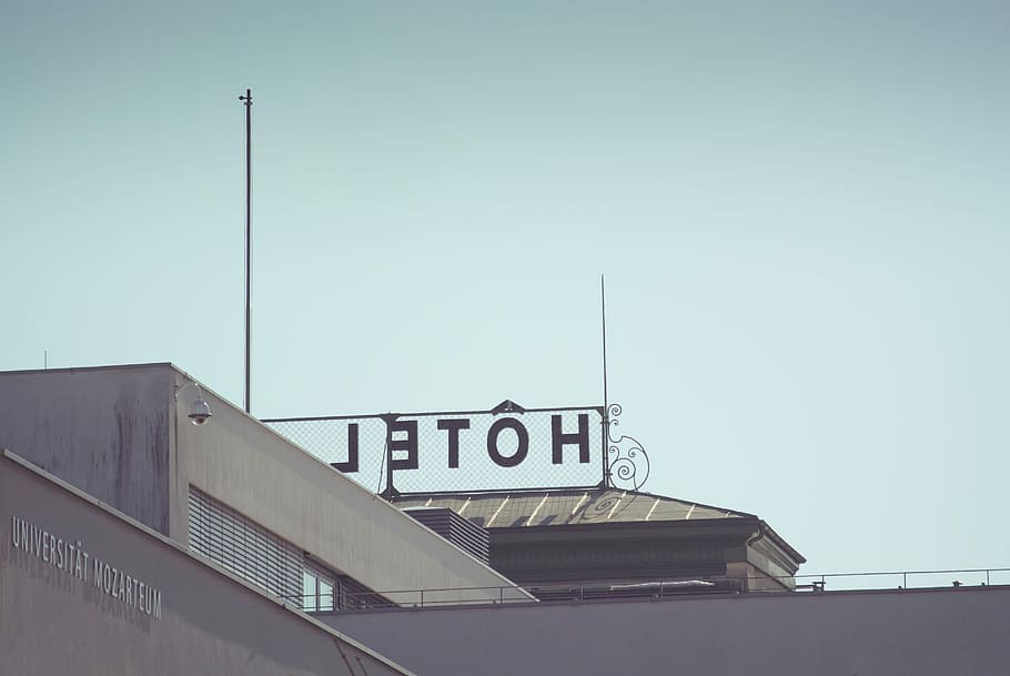 black metal HOTEL signage above high rise building, text, clear sky HD wallpaper
