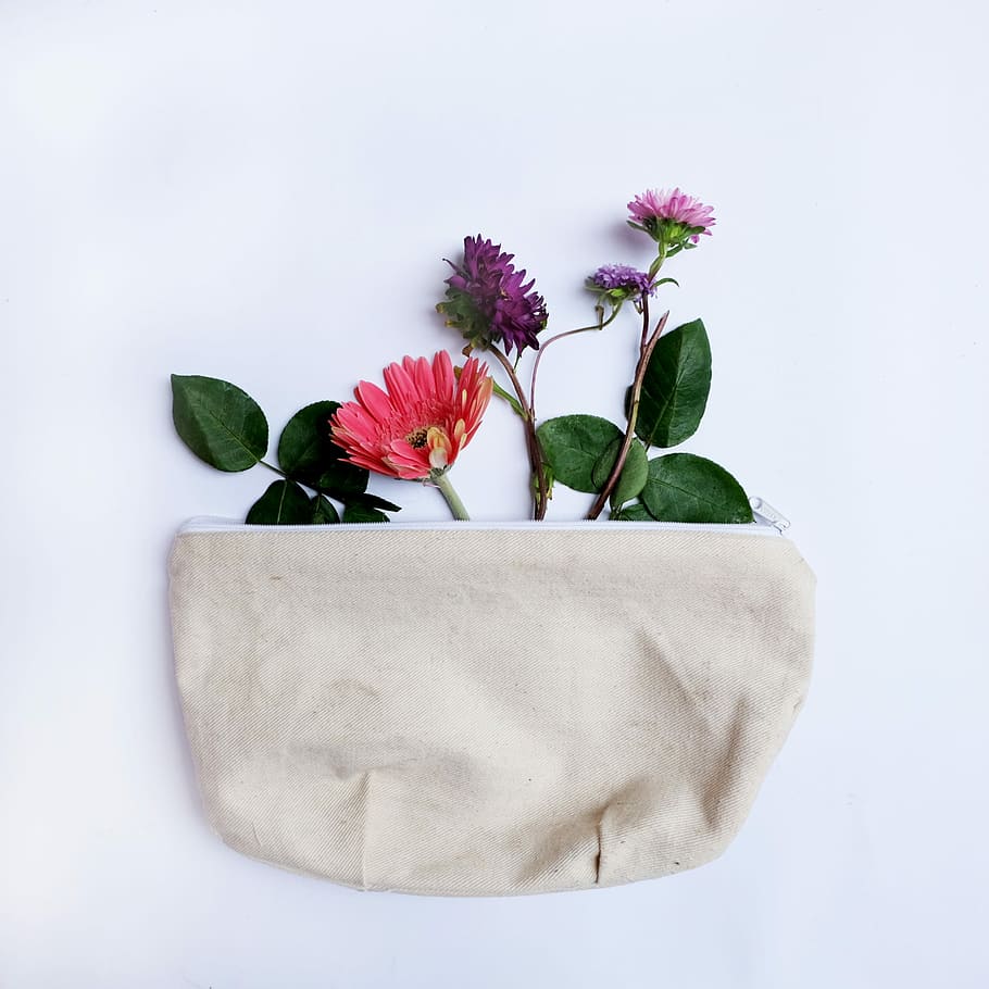 flower in bag, pink and purple flowers, floral, pouch, flat lay HD wallpaper