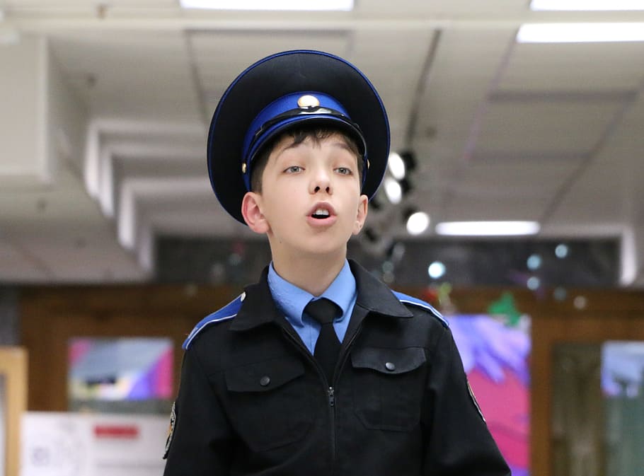 boy showing teeth while wearing black collared shirt, cadet HD wallpaper