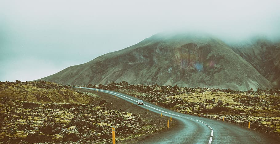 landscape photography of road between mountains, vehicle on gray road near mountain HD wallpaper