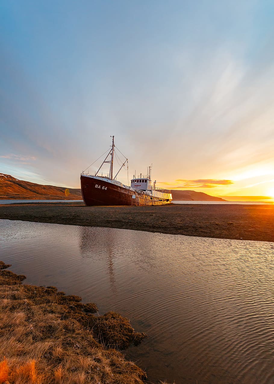 white and brown ship on seashore under sunrise, black and white ship on body of water during daytime HD wallpaper