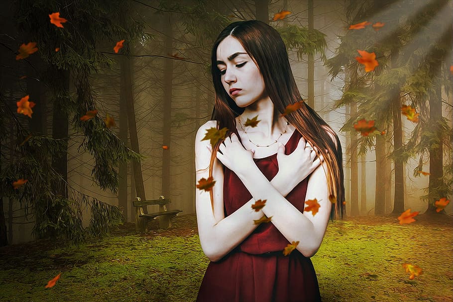 woman wearing red dress standing with falling leaves at forest HD wallpaper