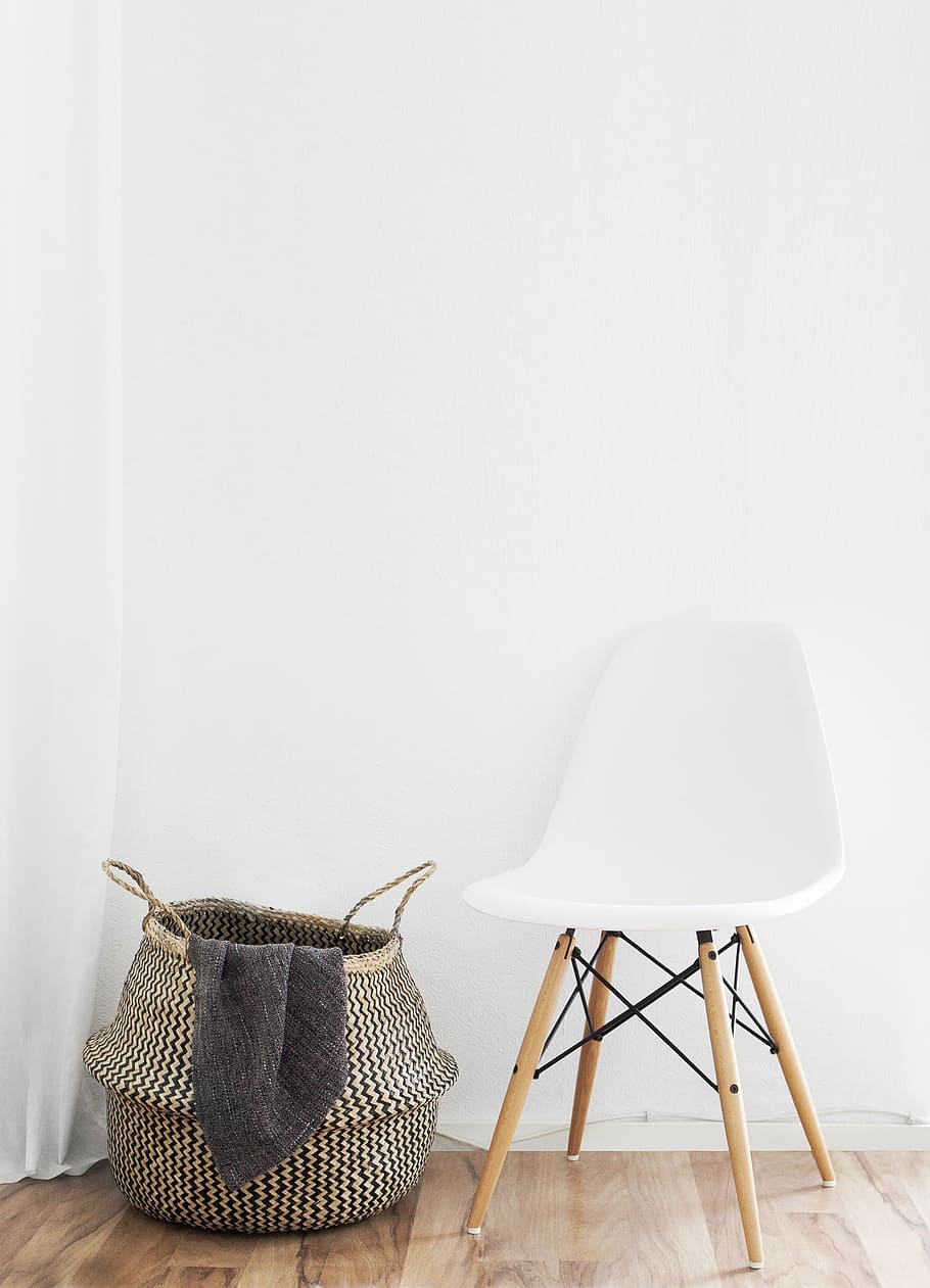 white and brown wooden chair beside gray storage carrier, near