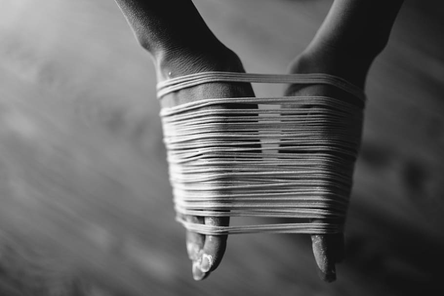 person making noodles, grayscale photo of person's hands binded by threads HD wallpaper