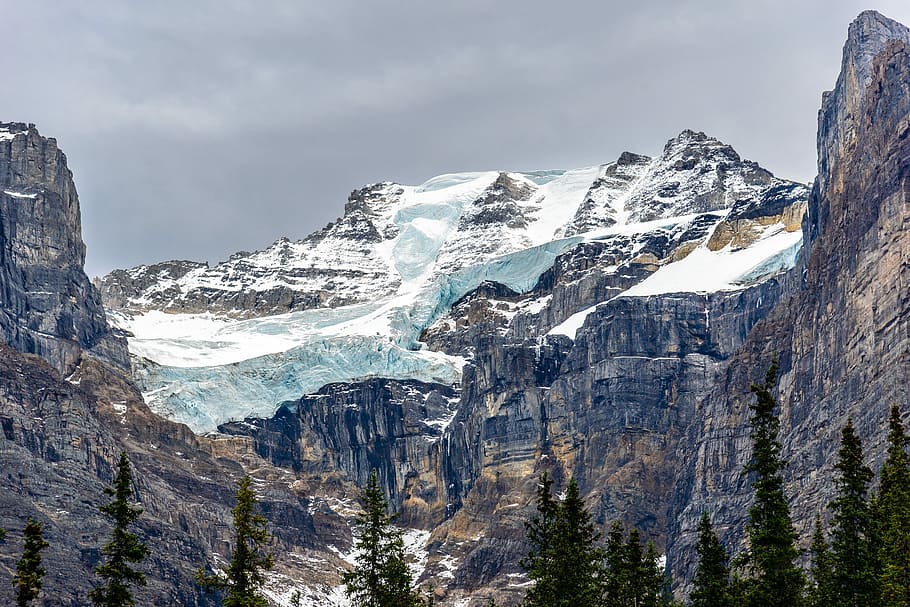 rocky mountain under gray sky, snow-capped mountain under gray clouds HD wallpaper