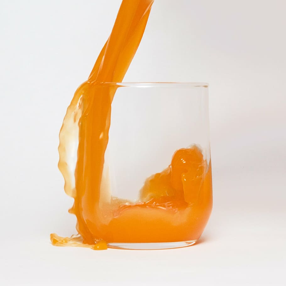 clear rock glass filled with orange liquid, cup, juice, casting HD wallpaper
