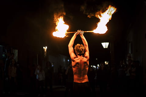 man doing fire dance, fire dancer, fire show, man holding fire HD wallpaper