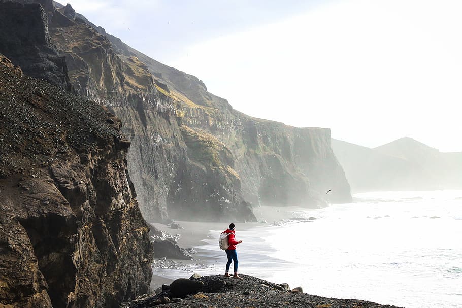 action, beach, cliff, daylight, hike, hiker, island, landscape HD wallpaper