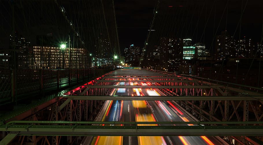 time lapse photo of bridge, time-lapse photography of vehicle crossing road between city buildings HD wallpaper