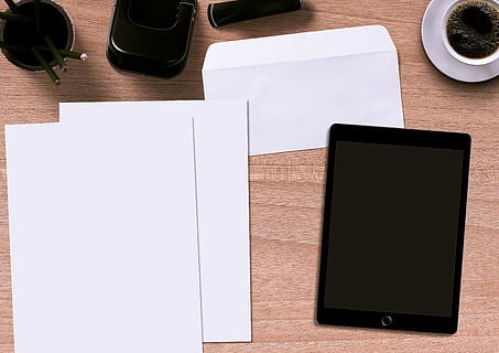 flat lay photography of space gray iPad beside papers, writing pad HD wallpaper