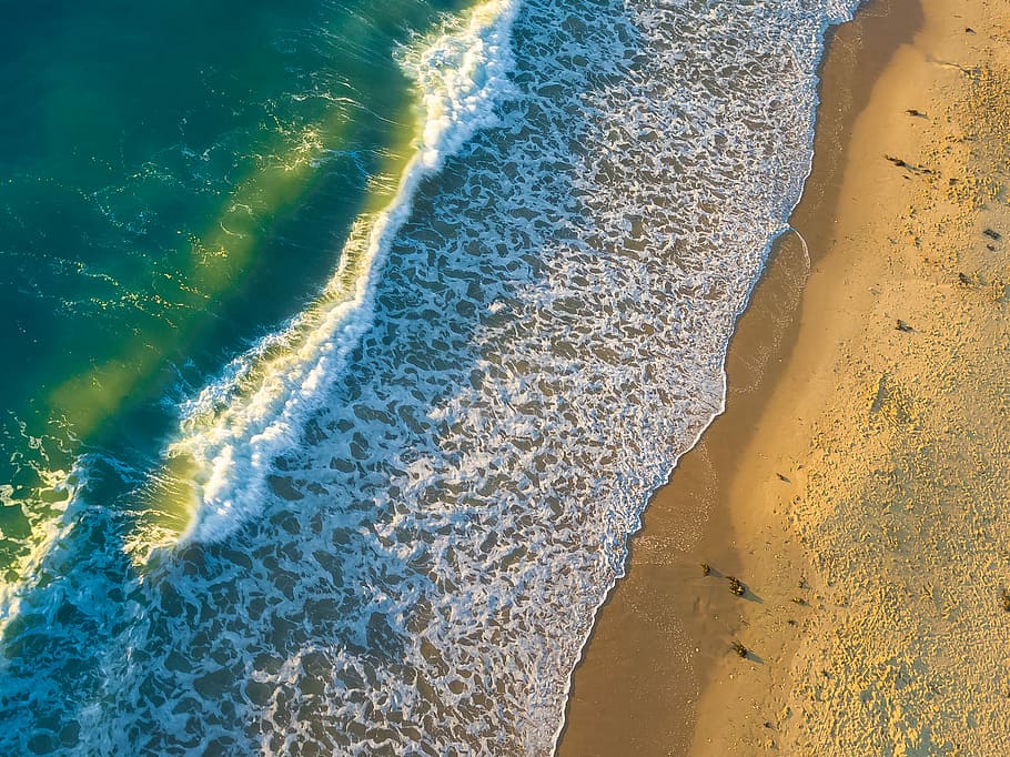 aerial photo of green and white sea with foam on shoreline at daytime, top view of body of water during daytime HD wallpaper