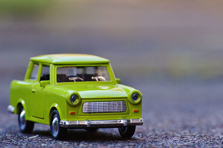 selective focus photography of green car die-cast metal model on concrete road at daytime, HD wallpaper