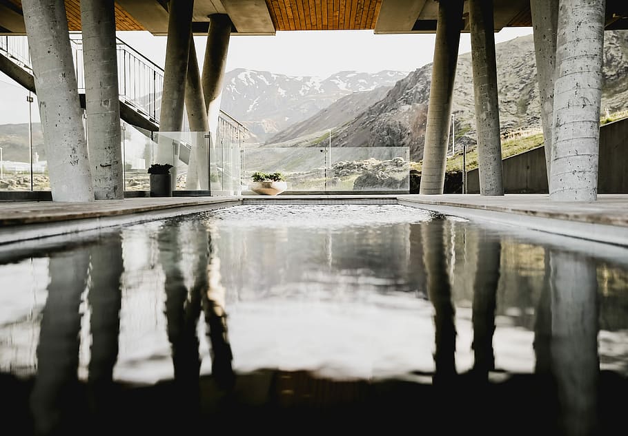 photo of body of water under bridge, gray concrete bridge above pool facing the mountain HD wallpaper