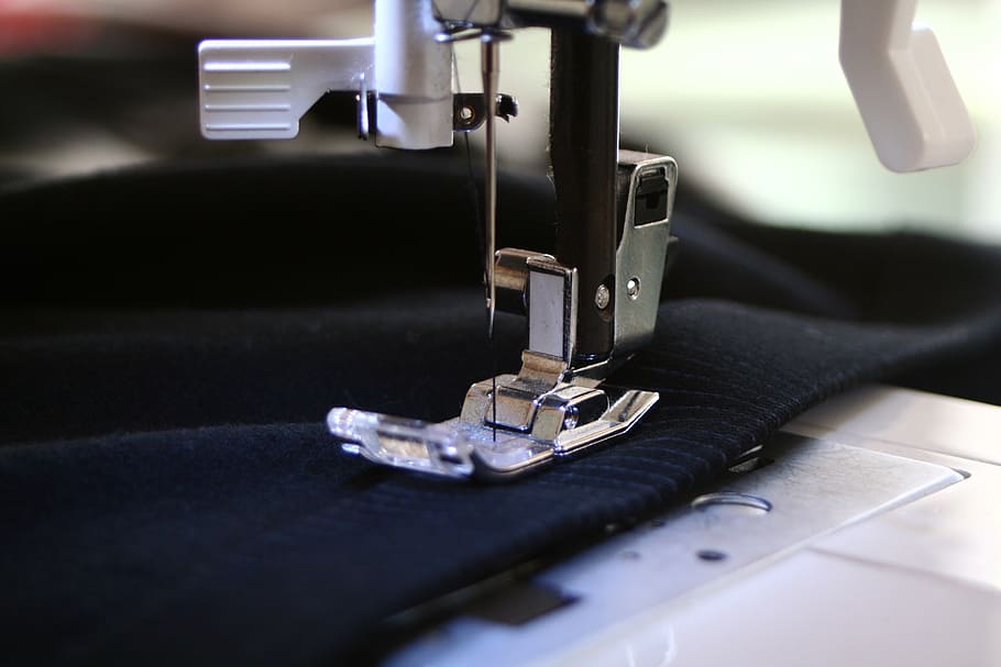 close-up photography of white electric sewing machine, precision