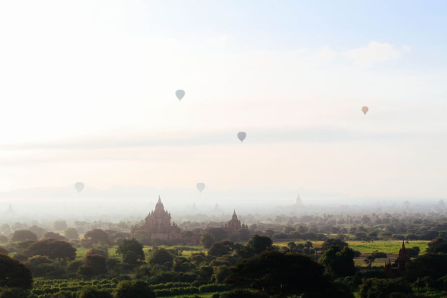 hot air balloon flying on the sky, aerial view of trees and houses HD wallpaper