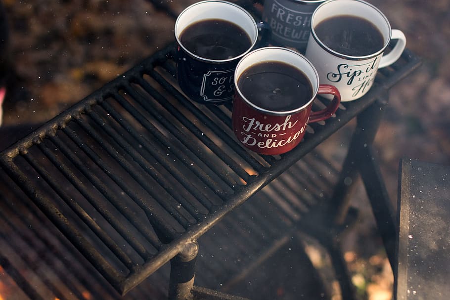 four assorted-color ceramic mugs on black grill frame, several coffee mugs HD wallpaper