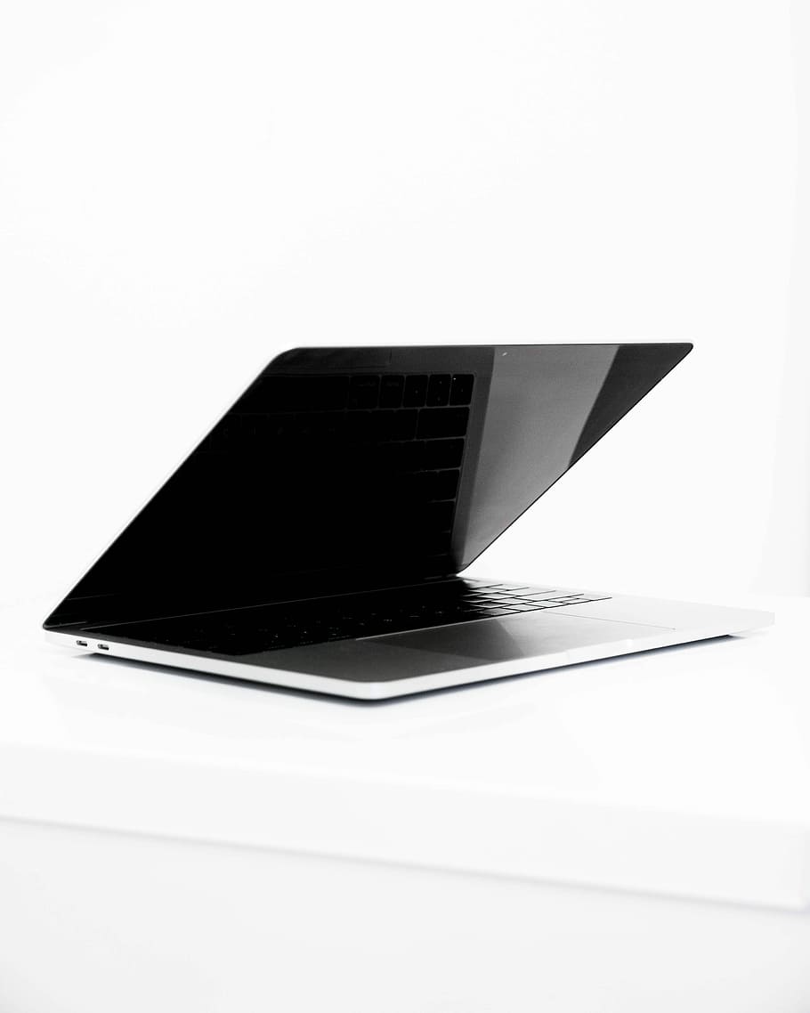 Macbook monochrome, grey and black laptop computer in middle HD wallpaper