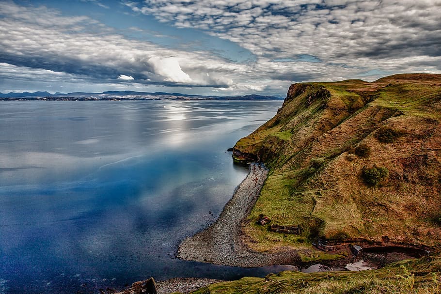 green and brown cliff over body of water during daytime, landscape HD wallpaper