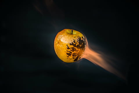 yellow apple against black background, close, photo, burned HD wallpaper