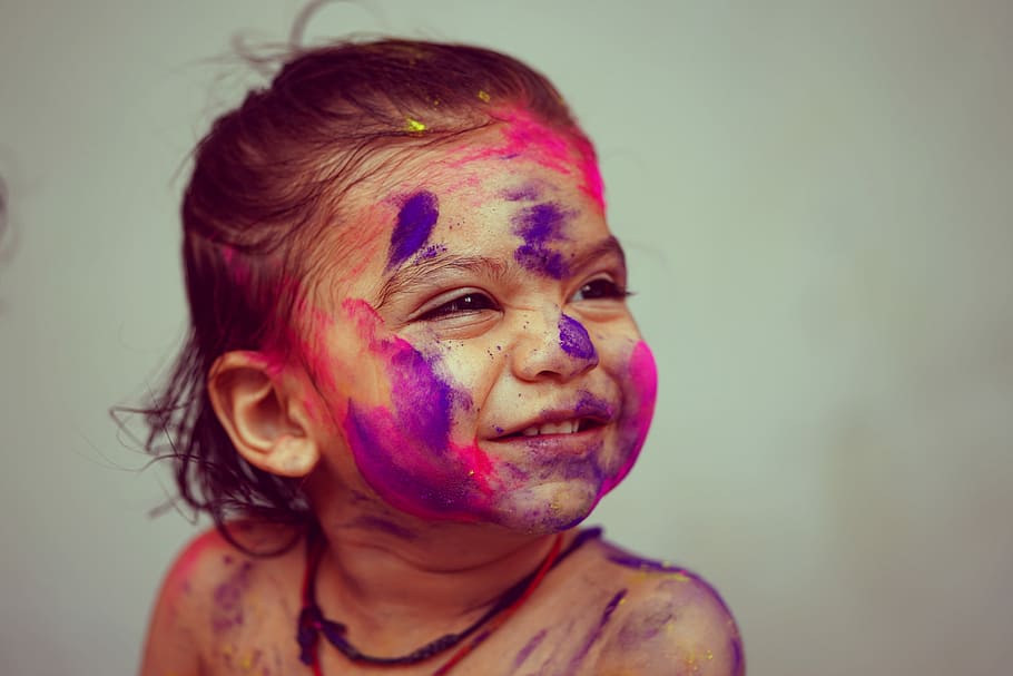 selective focus photography toddler girl with face paint, closeup photo of girl smiling with paint on her face HD wallpaper