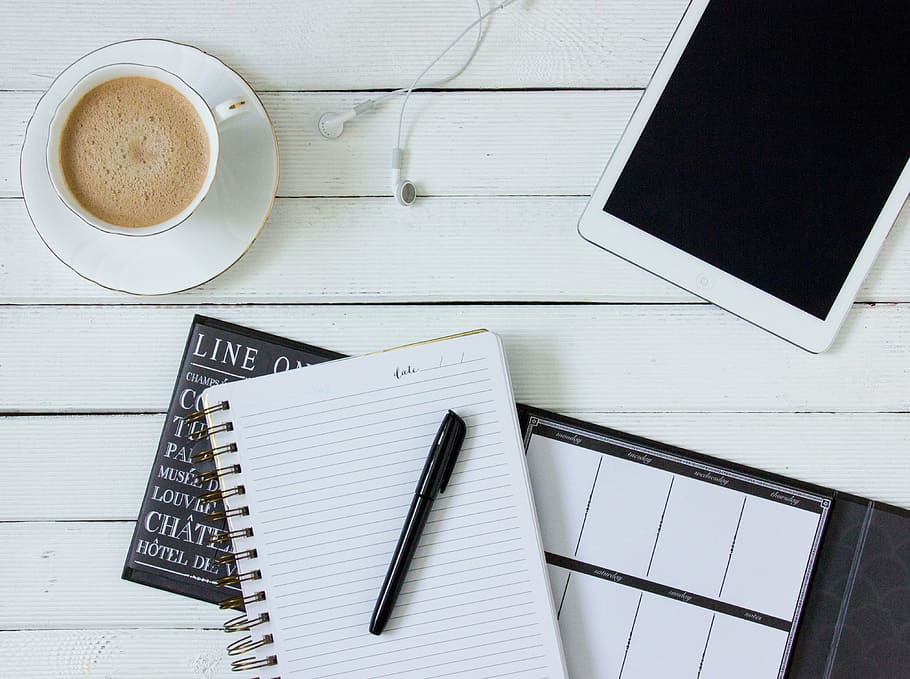 black pen on white and black lined paper, coffee, tablet, headphones HD wallpaper