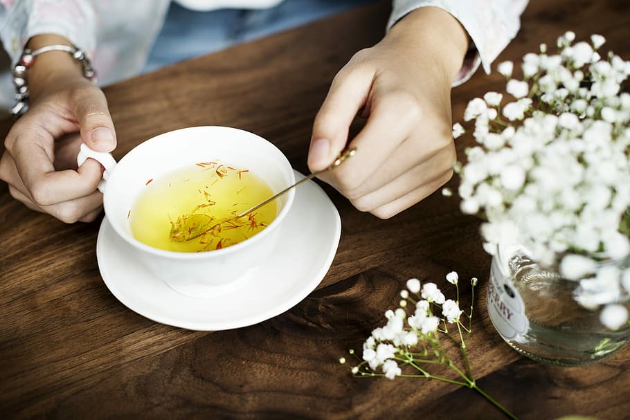 person holding spoon and teacup, flower, mug, drinking, beverage HD wallpaper