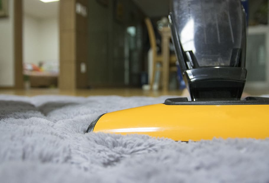 yellow and black upright vacuum on gray fleece rug inside room HD wallpaper