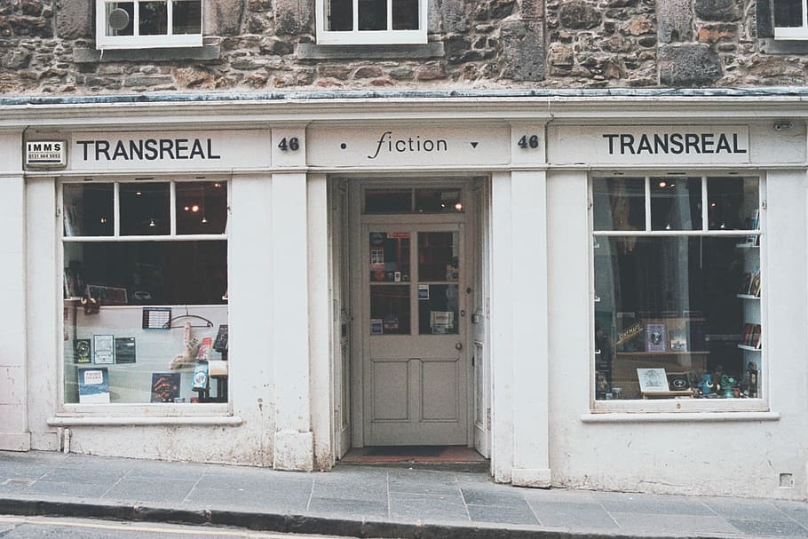 white storefront, photo of white Transreal Fiction store at daytime