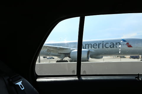 Silver American Airlines plane from taxi window in Miami with blue sky, car view photography of American airplane HD wallpaper