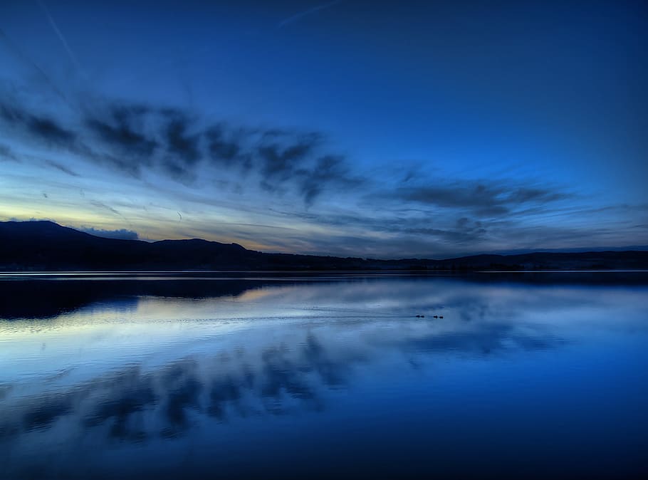 calm body of water during daytime, kochelsee, dark, evening, blue