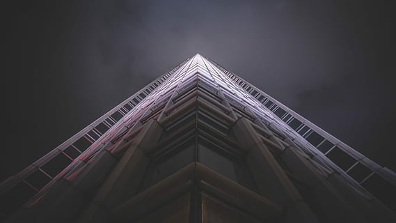 low-angle photography of white high-rise state of the art building, worms eye view of gray building HD wallpaper
