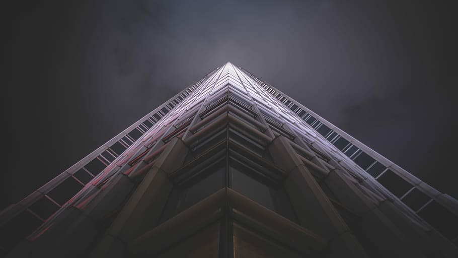 low-angle photography of white high-rise state of the art building, worms eye view of gray building HD wallpaper