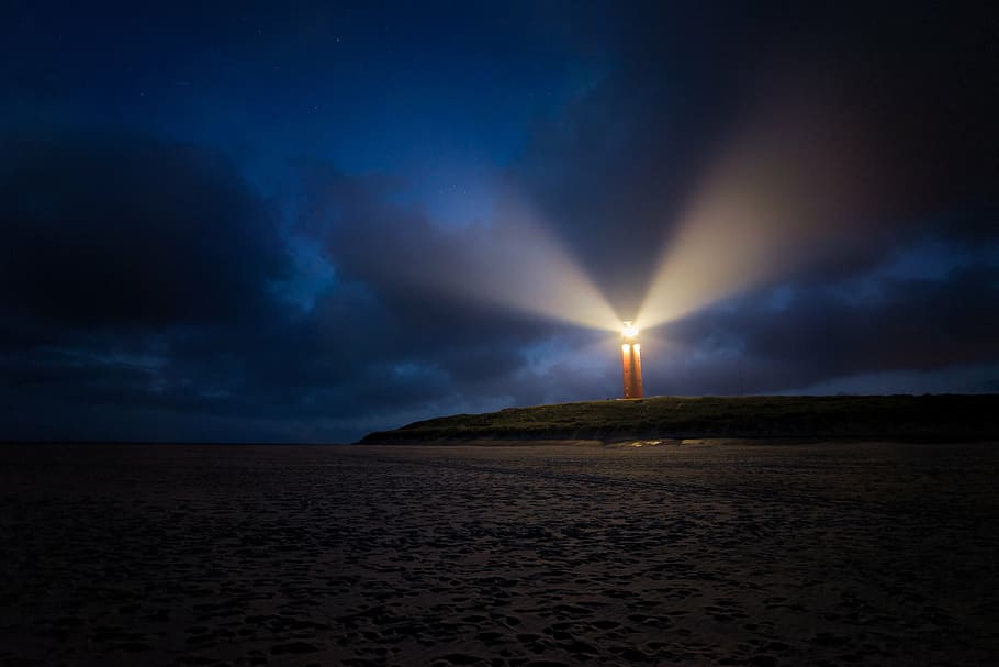 turned on lighthouse during night time, clouds, sea, evening sky HD wallpaper