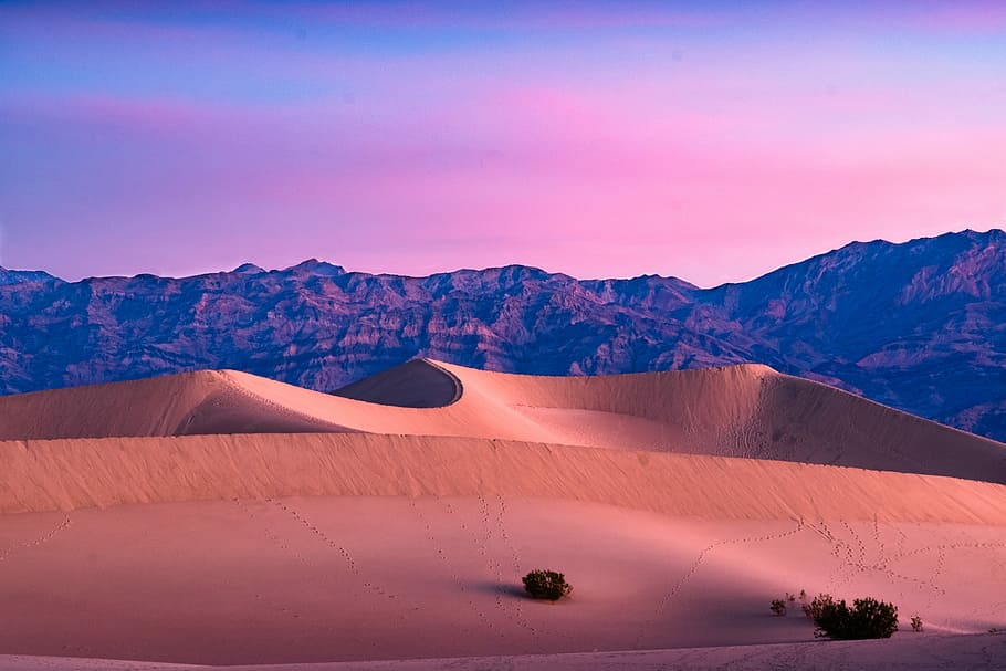 desert mountain under cloudy skies, aerial photography of desert field during golden hour HD wallpaper