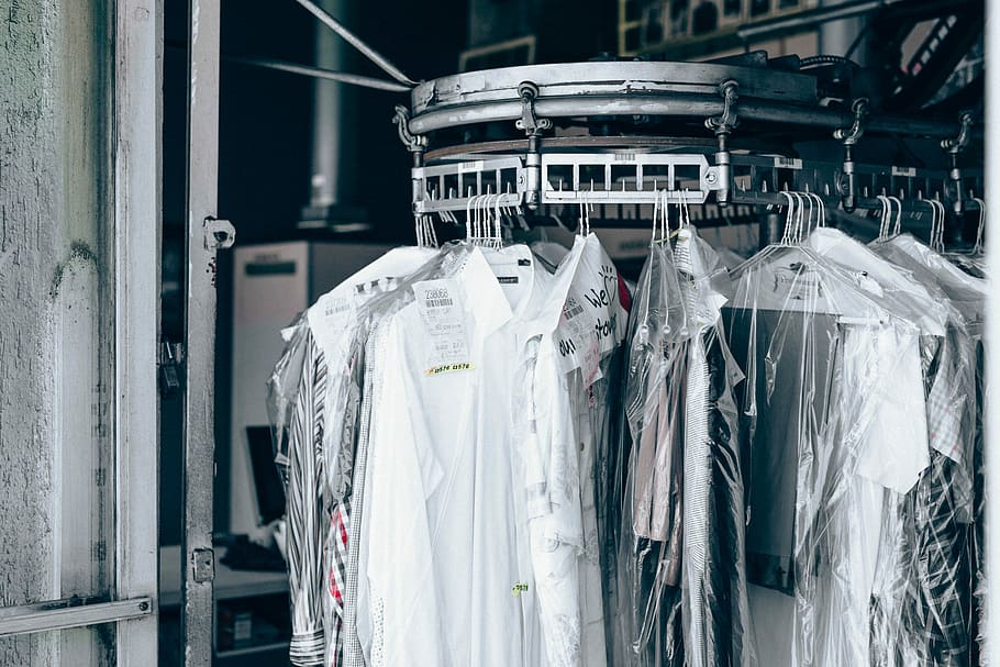 close-up photo of top hanged on rack, white shirts on stainless steel organizer HD wallpaper