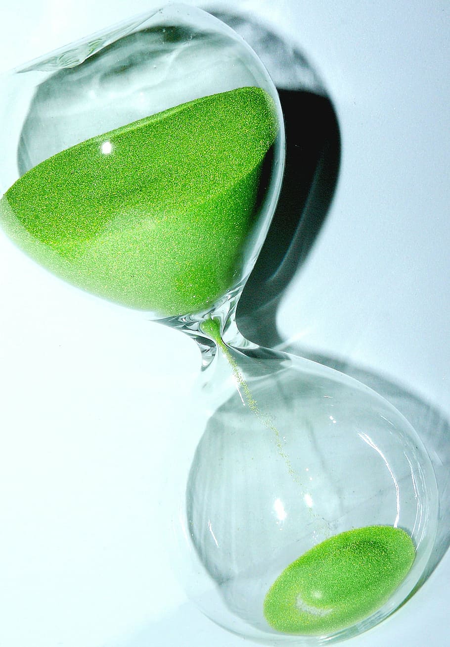 clear and green hourglass on white surface, temporal distance HD wallpaper