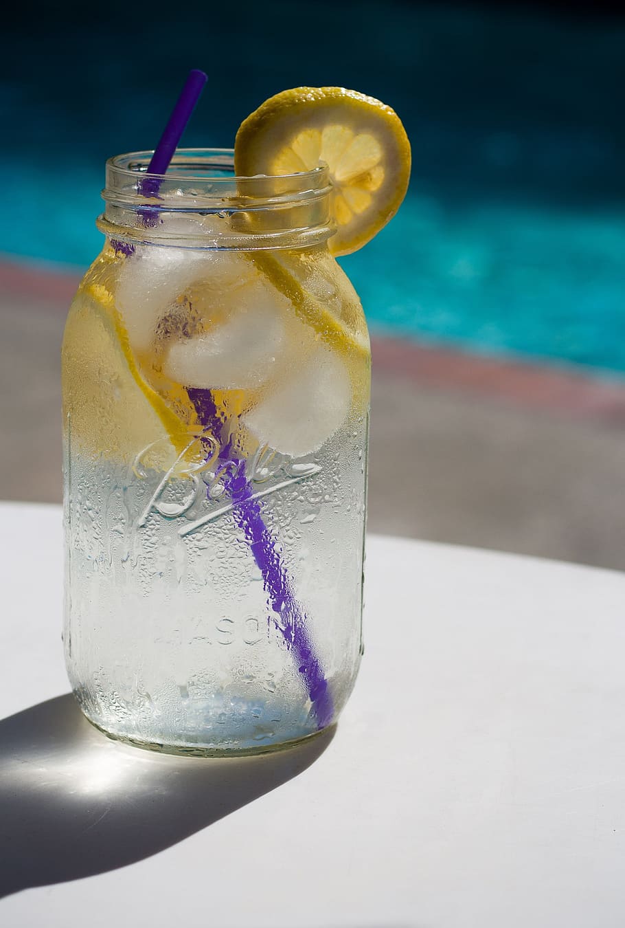 selective focus photography of clear glass mason jar with lemonade and purple straw HD wallpaper