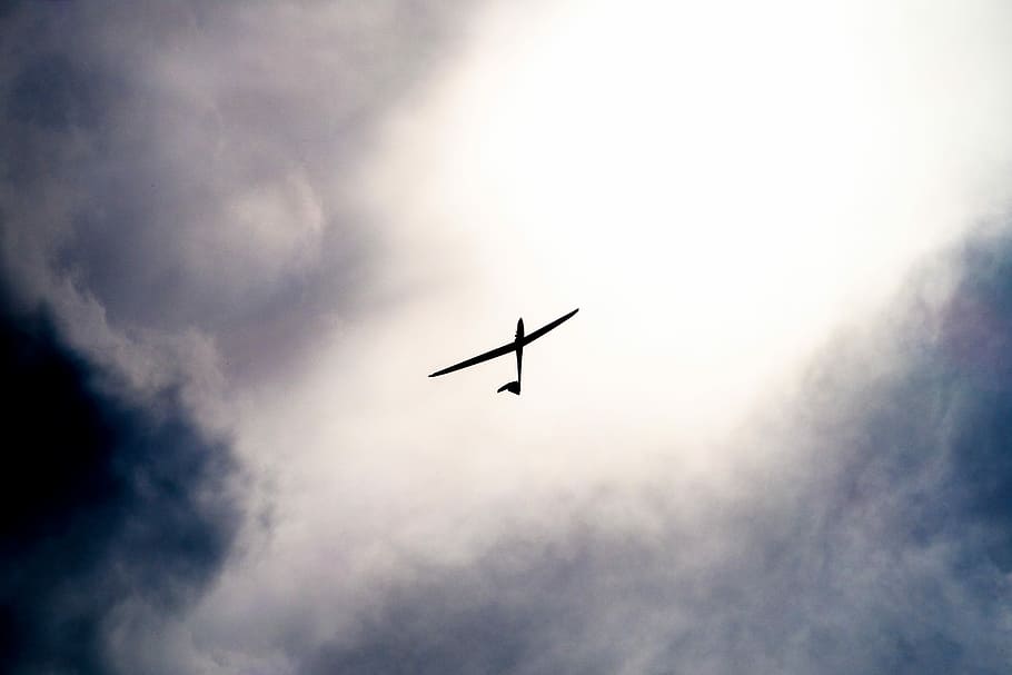 white toy plane under white sky, black airplane at daytime photo, HD wallpaper