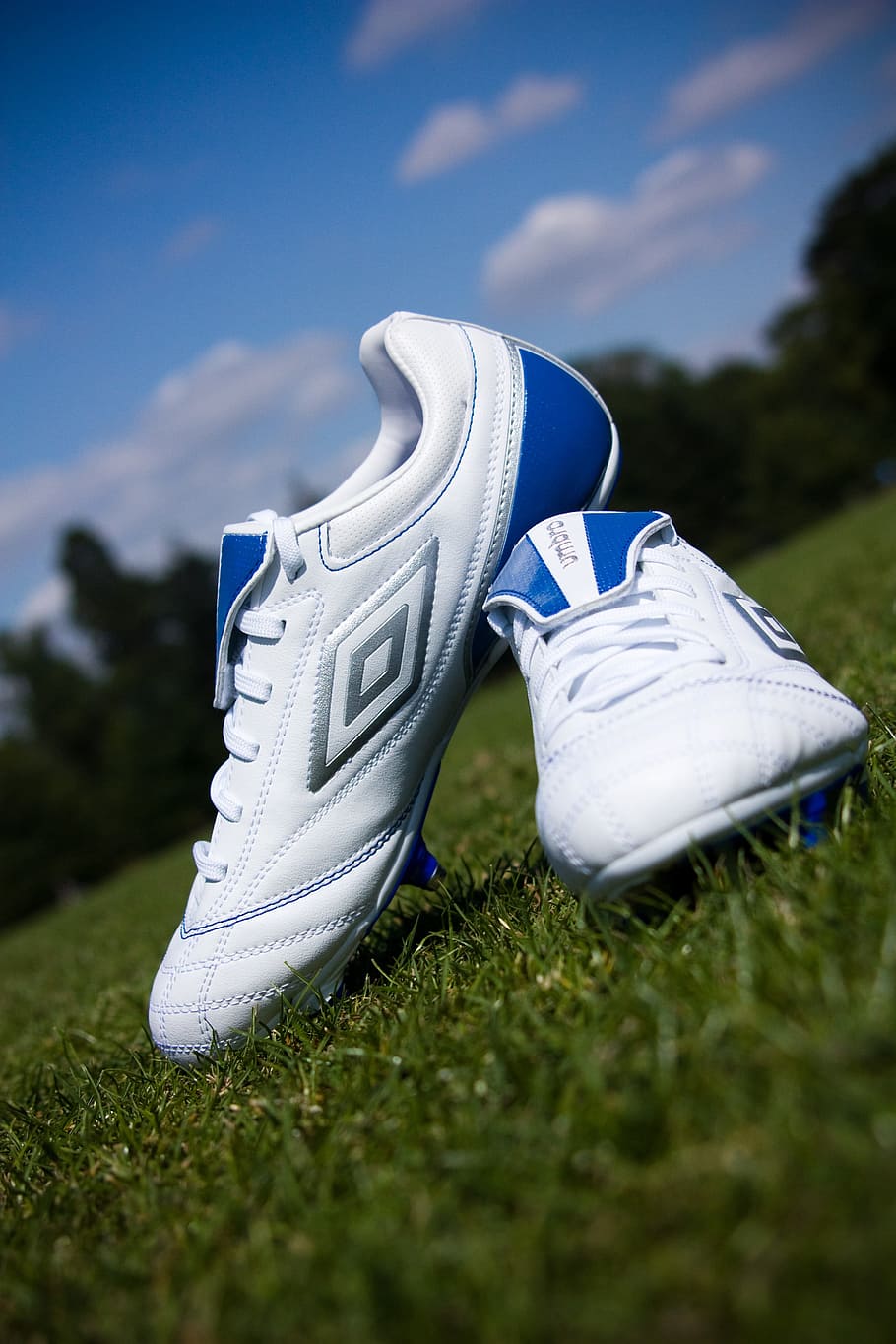 selective focus photography of white-and-blue Umbro cleats, Football, Boots