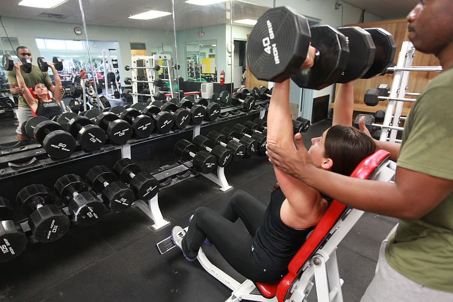 woman in black tank top holding black dumbbells, weights, lifting HD wallpaper