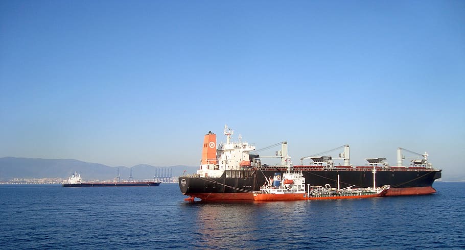 black ship on sea at daytime, gibraltar, strait, mountains, cliff