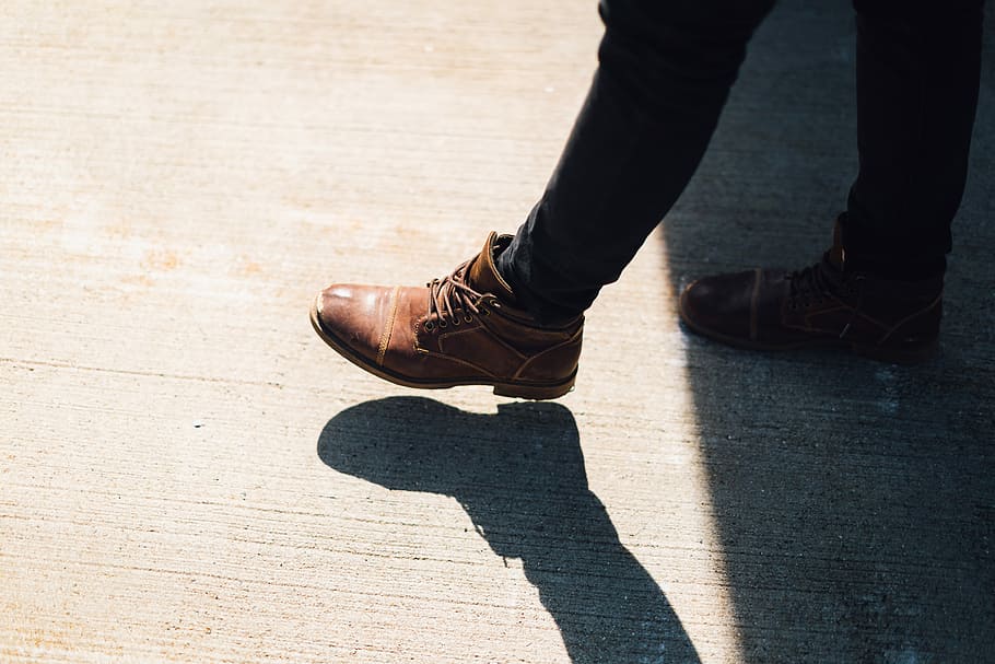 person wearing brown leather boots walking on gray concrete during daytime, person wearing brown leather dress boots walking HD wallpaper