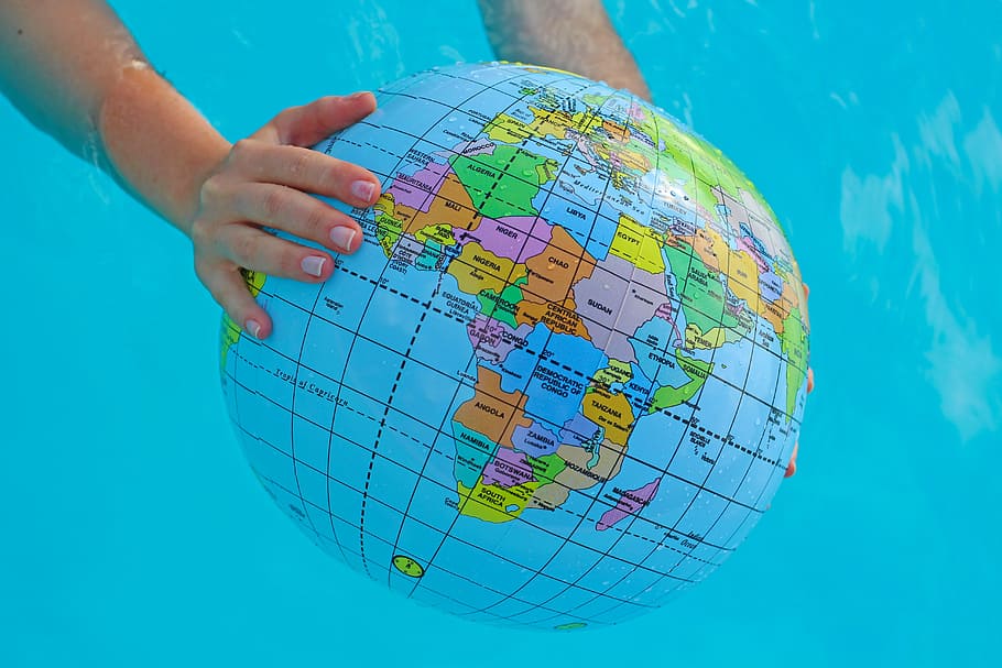 person holding globe model, summer season, world, travel, tour, HD wallpaper